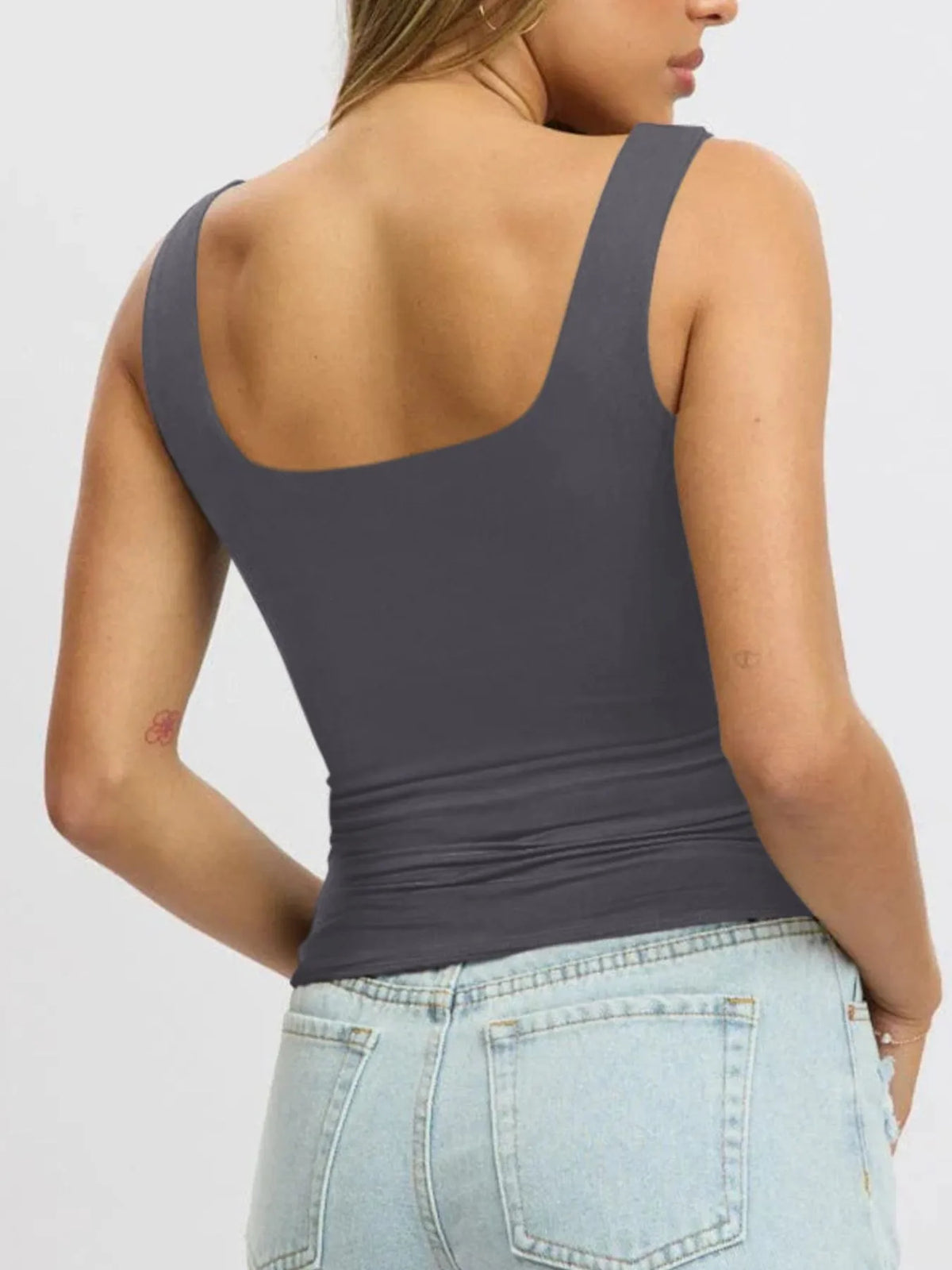 Breathable sleeveless blouse for women, cropped fit, perfect for layering under cardigans or jackets.