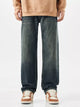 Men's relaxed fit wide leg jeans in vintage blue wash, front view.