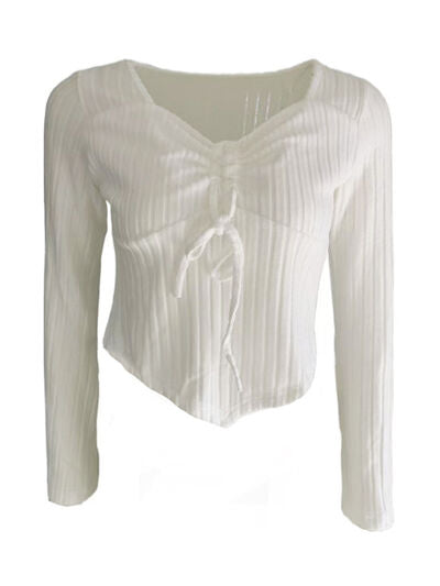 Women’s ruched drawstring ribbed long sleeve top in beige, styled with jeans for casual fall outfit