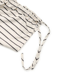Women's Striped Half Sleeve Blouse laid flat on a table with accessories