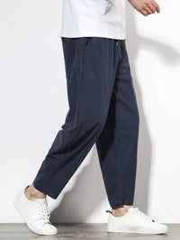 Plus size men's relaxed fit pants showing multiple pockets and style