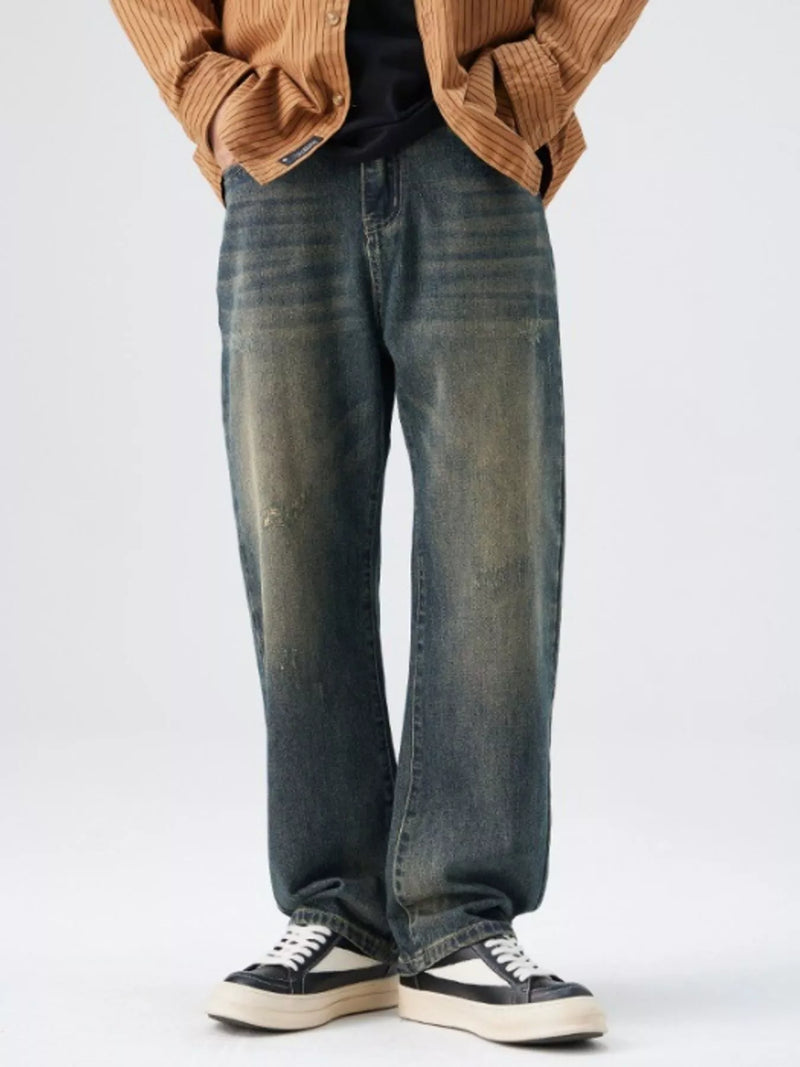 Men's Washed Wide Leg Jeans - Front view showing relaxed fit and light blue wash on a model.