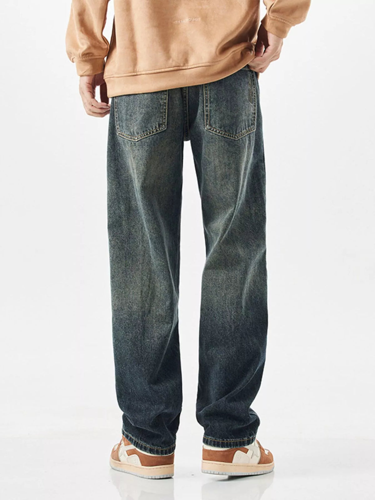 Side profile of men's 90s style wide leg denim pants showcasing the fit.