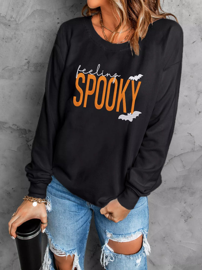 Feeling Spooky Halloween embroidered sweatshirt for women, black crewneck fall fashion.