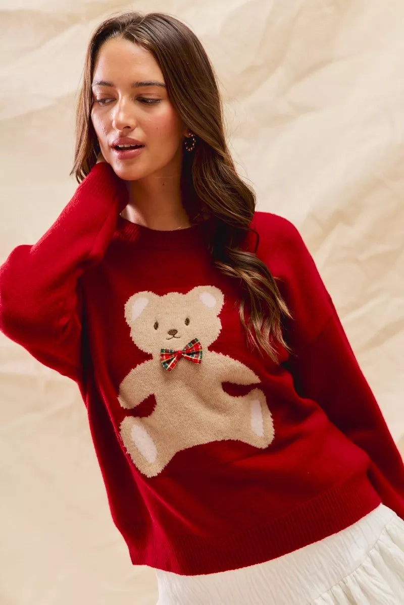 Cozy Teddy Bear Christmas Sweater with red check ribbon and festive holiday design on a soft women's pullover.
