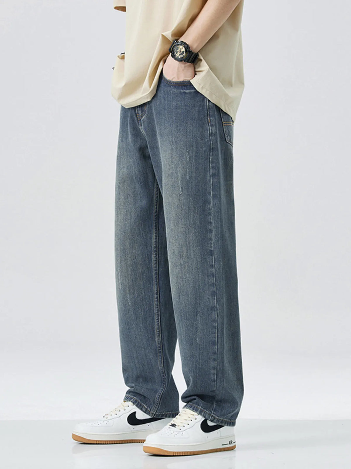 Men's washed wide leg relaxed fit jeans front view laid flat