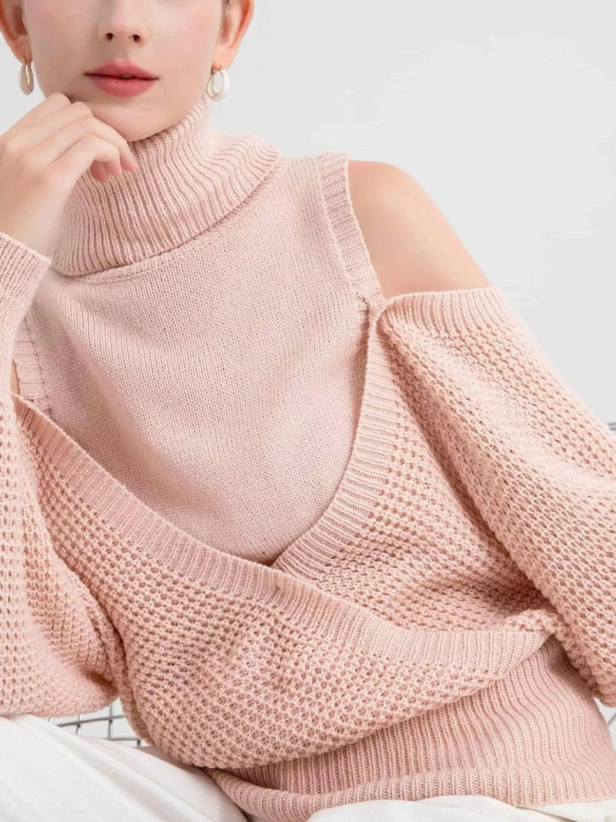 Oversized Cold Shoulder Sweater in Cream knit worn with denim jeans