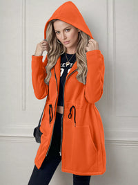 Women's lightweight zip up hoodie jacket in Orange with front pockets.