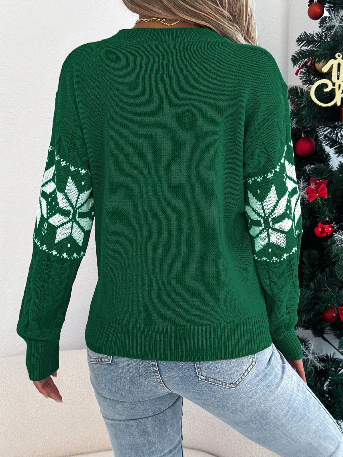 Women's Christmas Cable Knit Sweater with a close-up of the festive snowflake and cable knit pattern.