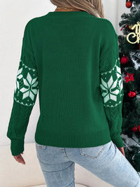 Women's Christmas Cable Knit Sweater with a close-up of the festive snowflake and cable knit pattern.