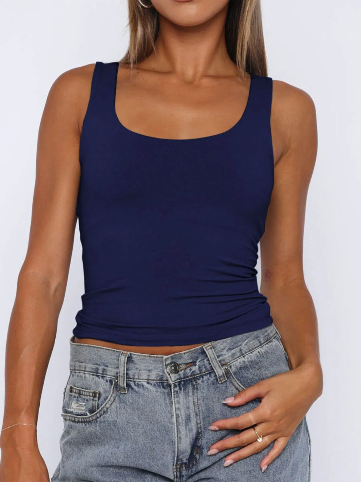 Breathable sleeveless blouse for women, cropped fit, perfect for layering under cardigans or jackets.