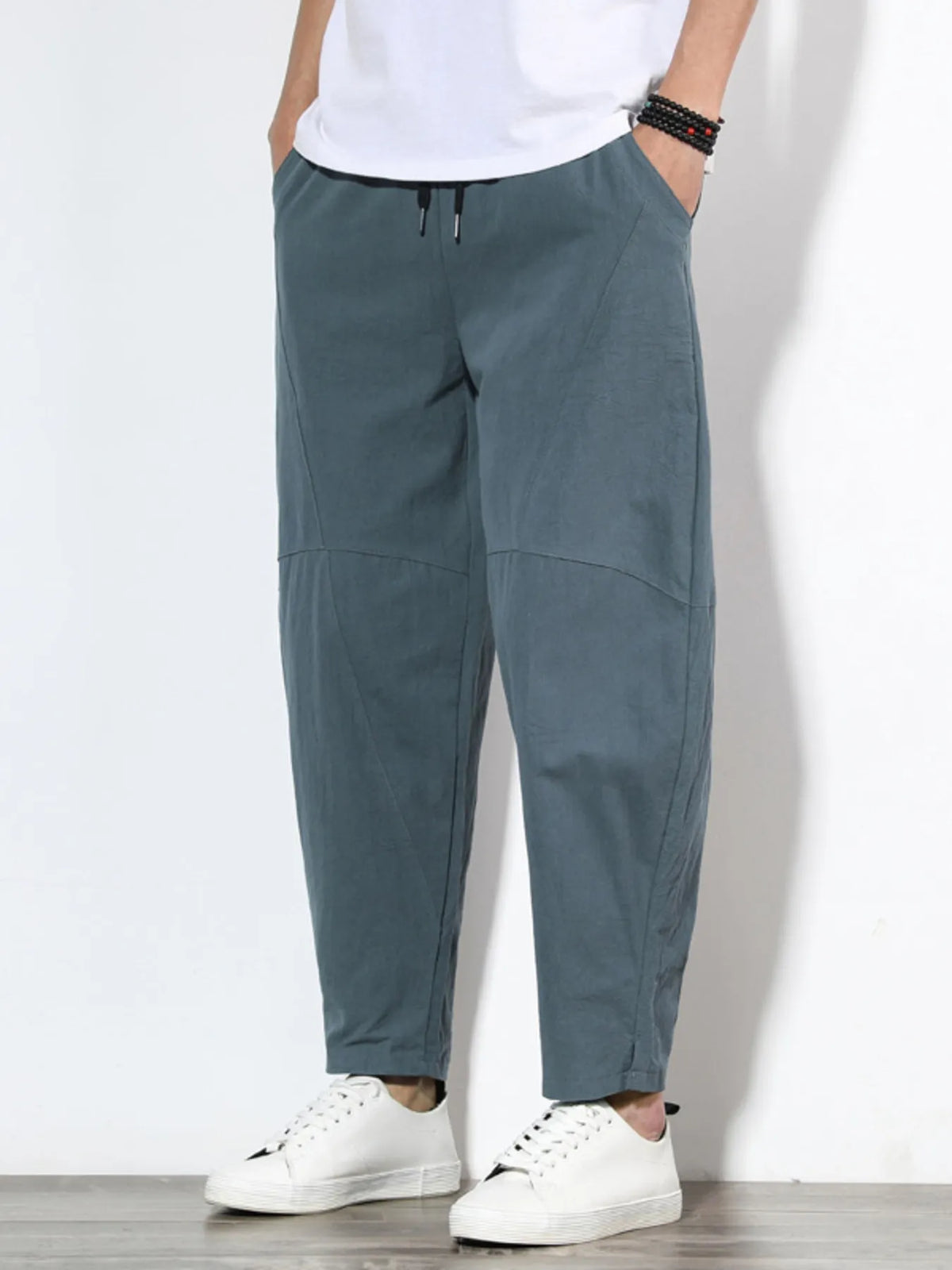 Plus size men's relaxed fit pants showing multiple pockets and style