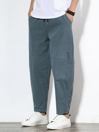 Plus size men's relaxed fit pants showing multiple pockets and style