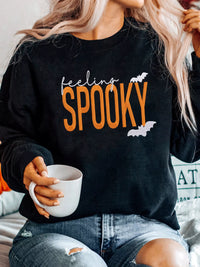 Feeling Spooky Halloween embroidered sweatshirt for women, black crewneck fall fashion.