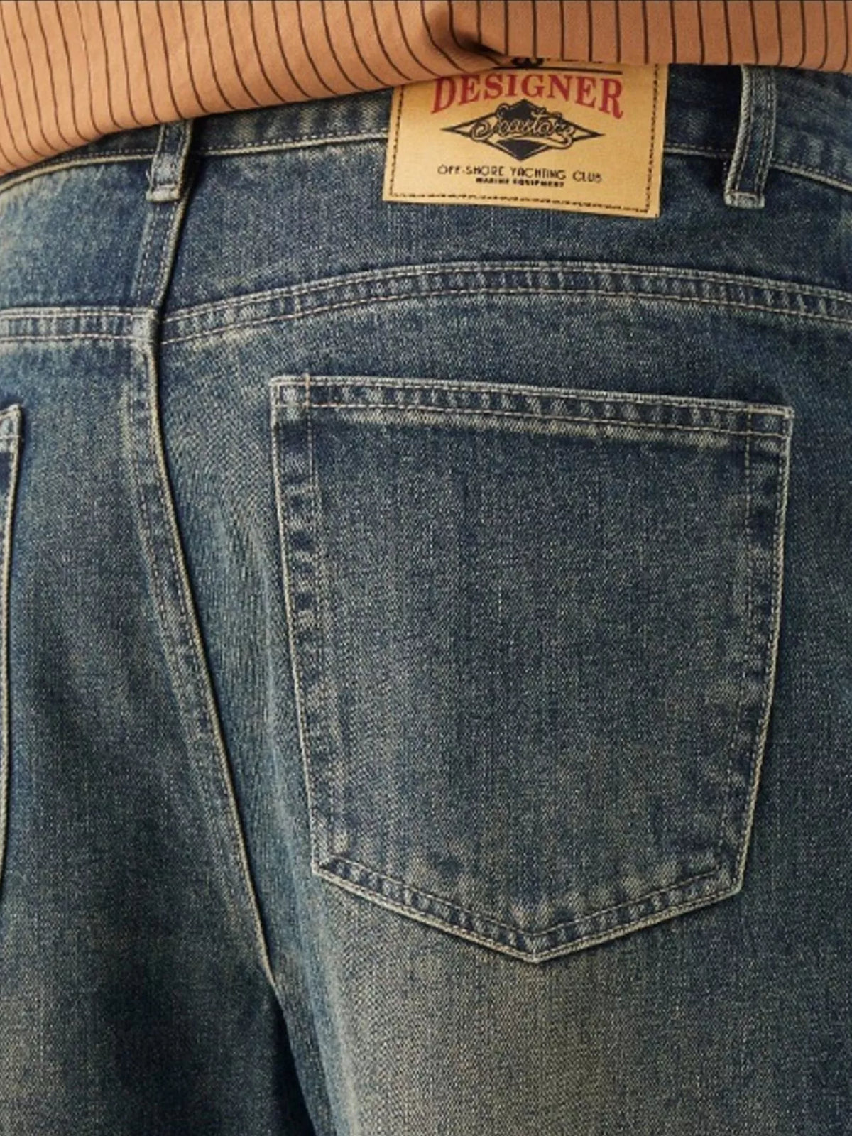 Men's Washed Wide Leg Jeans - Front view showing relaxed fit and light blue wash on a model.