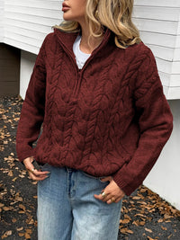 Women's Cable Knit Zip Neck Sweater in burgundy worn with boots