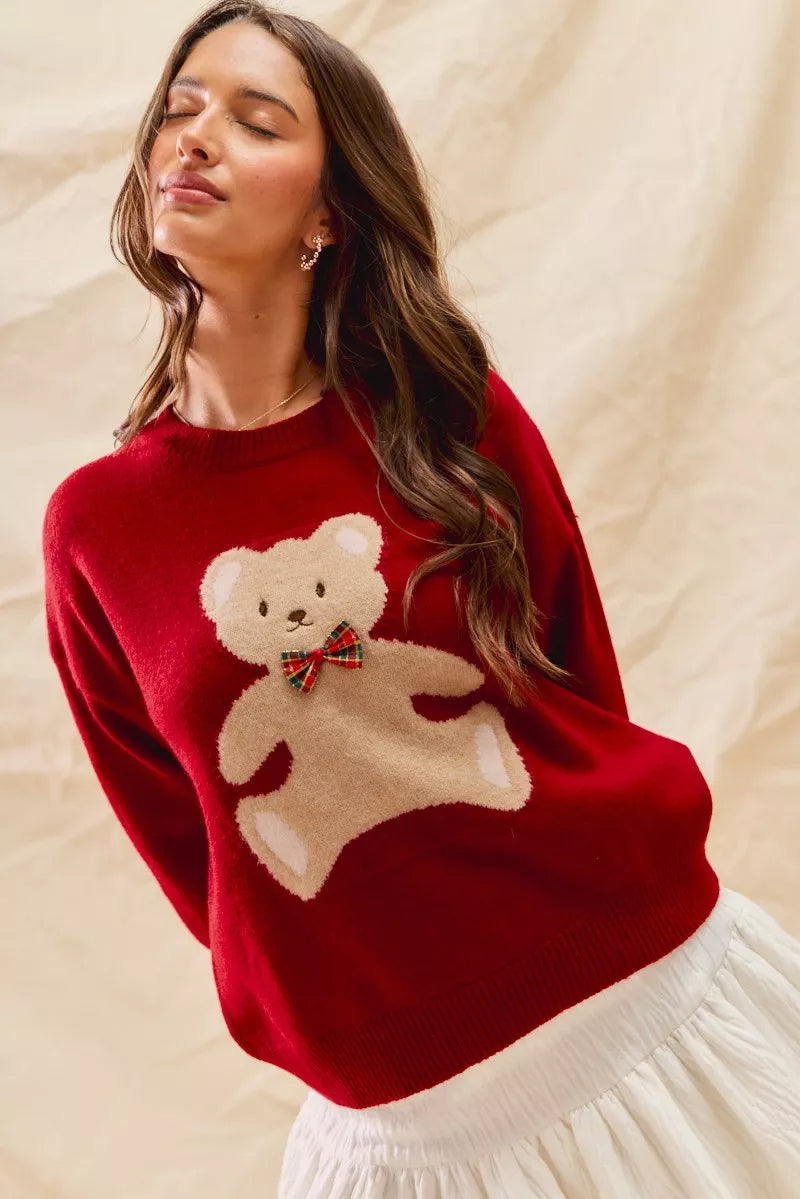 Cozy Teddy Bear Christmas Sweater with red check ribbon and festive holiday design on a soft women's pullover.