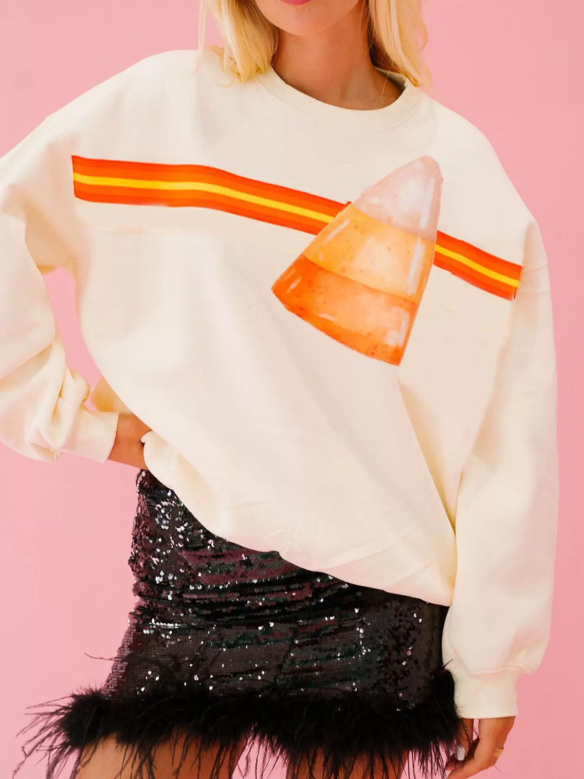 Spooky Halloween Sequin Sweatshirt showing the reversible design from black with orange sequins to orange with black sequins.