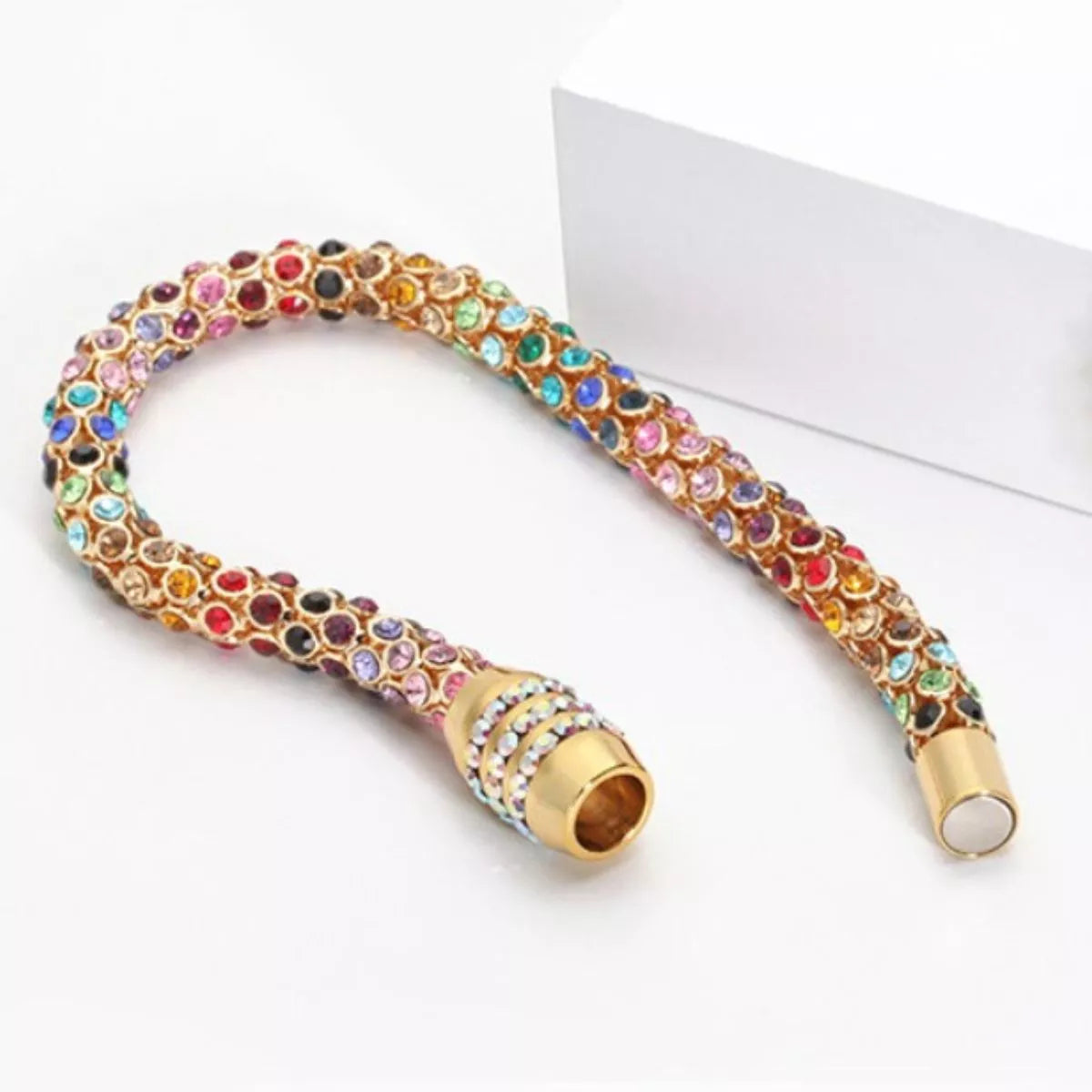 Rainbow Crystal Bracelet showcasing dainty gold chain with multicolored crystals.