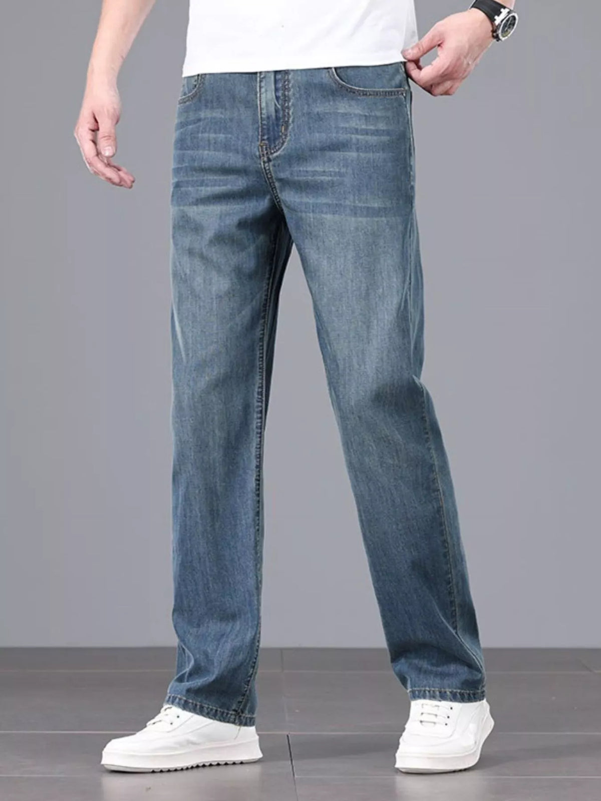Men's straight fit jeans in a dark wash, front view.