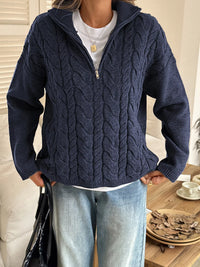 Women's Cable Knit Zip Neck Sweater in Navy worn with boots