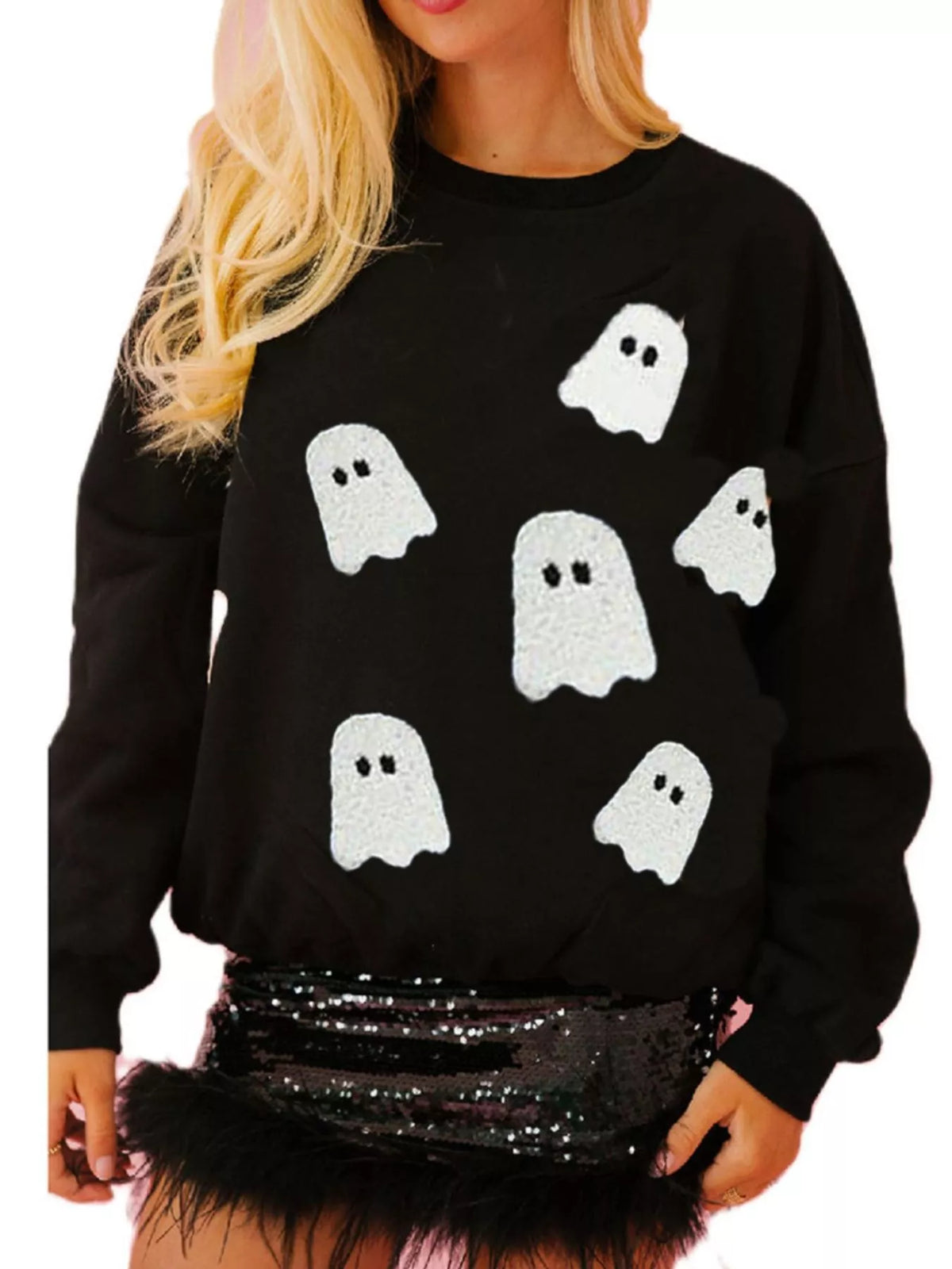Spooky Halloween Sequin Sweatshirt showing the reversible design from black with orange sequins to orange with black sequins.