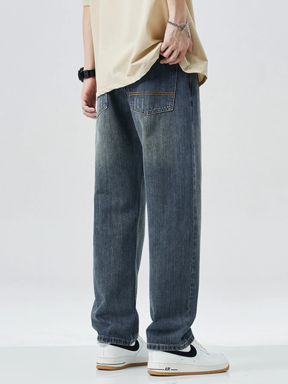 Men's washed wide leg relaxed fit jeans front view laid flat