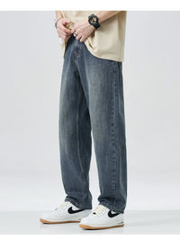 Men's washed wide leg relaxed fit jeans front view laid flat