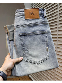 Men's distressed wide leg jeans in washed blue denim with knee rips, 90s grunge style