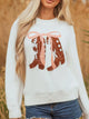 Women's Embroidered Bow Boots Drop Shoulder Sweater in cream, laid flat showing the detailed boot and bow design on the front.