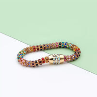 Rainbow Crystal Bracelet showcasing dainty gold chain with multicolored crystals.