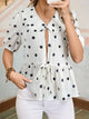 Polka Dot Puff Sleeve Top in black and white worn with denim jeans