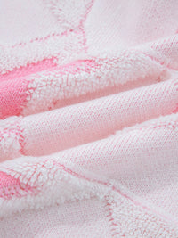 Oversized Star Pattern Sweater in White worn with boots