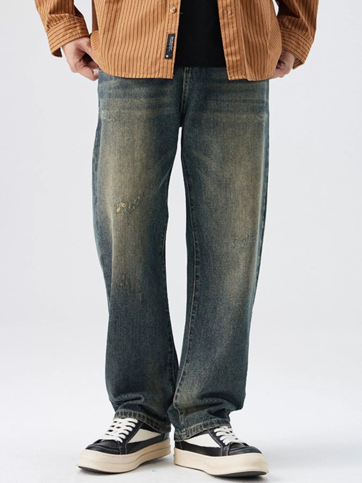 Men's Washed Wide Leg Jeans - Front view showing relaxed fit and light blue wash on a model.
