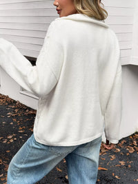 Women's Cable Knit Zip Neck Sweater in White worn with boots