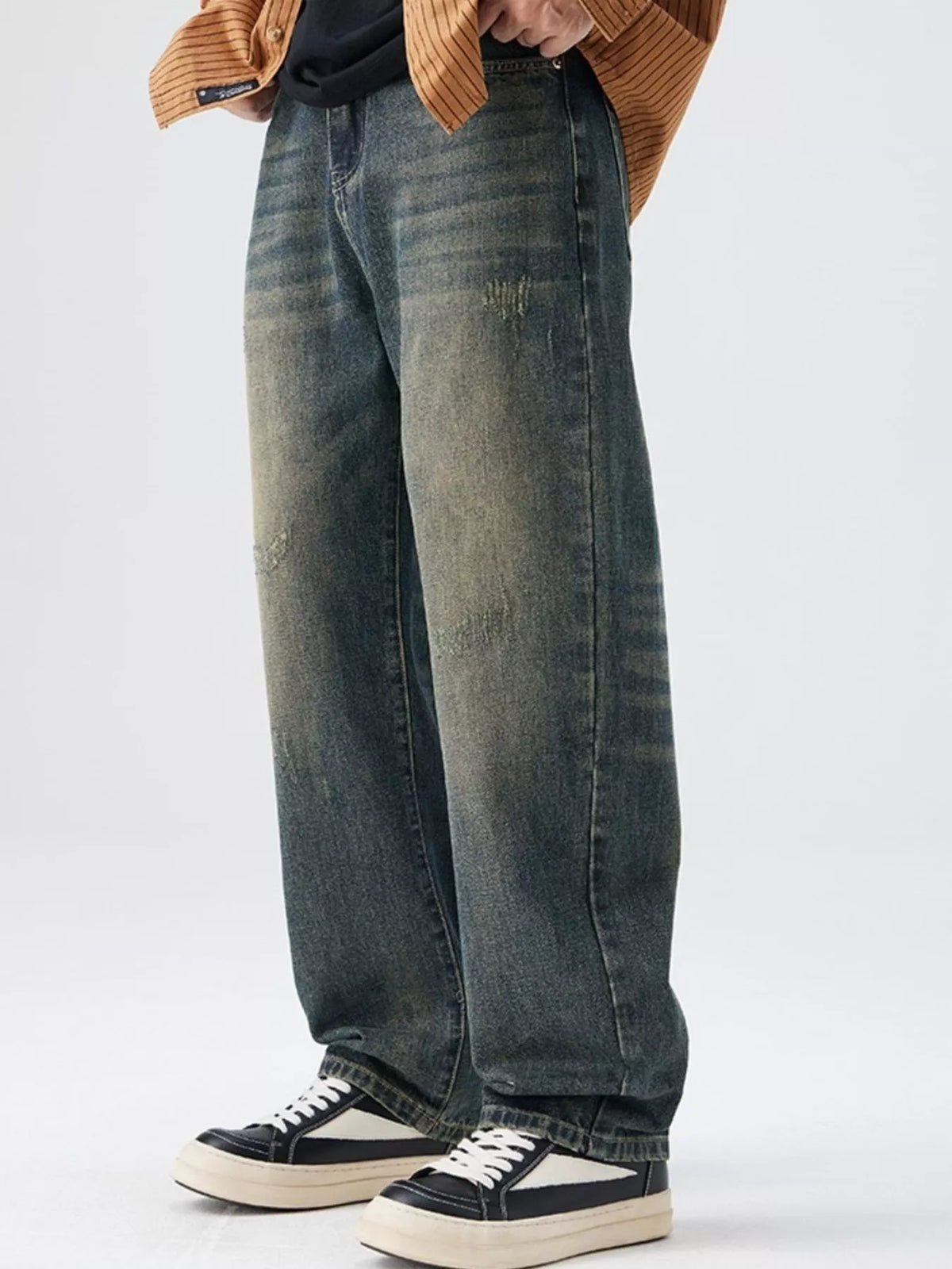 Men's Washed Wide Leg Jeans - Front view showing relaxed fit and light blue wash on a model.