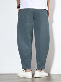 Plus size men's relaxed fit pants showing multiple pockets and style