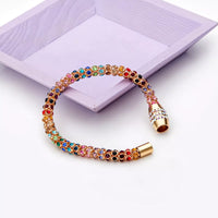 Rainbow Crystal Bracelet showcasing dainty gold chain with multicolored crystals.