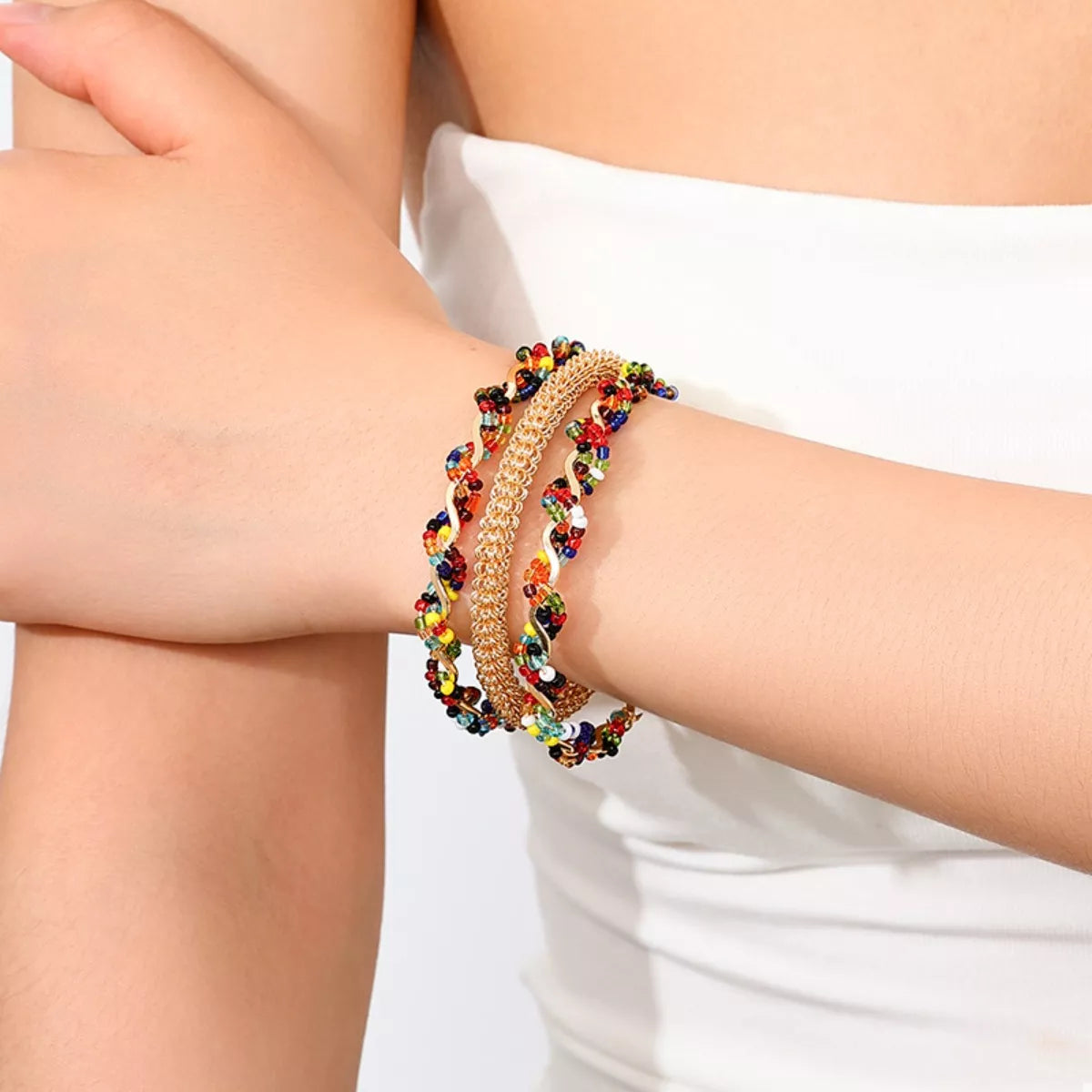 18K Gold Plated Three-Layer Bracelet Stack on a wrist, showing the dainty layered chain design.