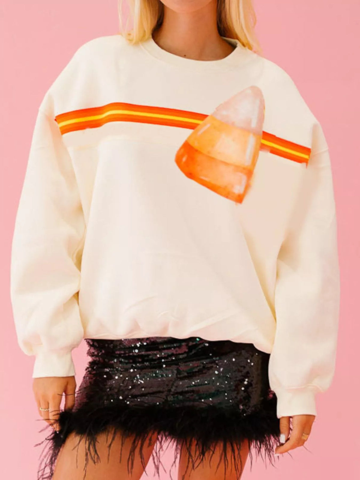 Spooky Halloween Sequin Sweatshirt showing the reversible design from black with orange sequins to orange with black sequins.