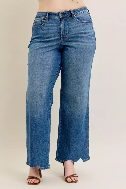 High Waist Tummy Control Jeans with Destroyed Hem on a plus-size model.
