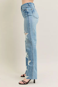 Judy Blue 90s Straight Jeans in a distressed wash, modeled from the front, showing the high waist and straight leg fit.