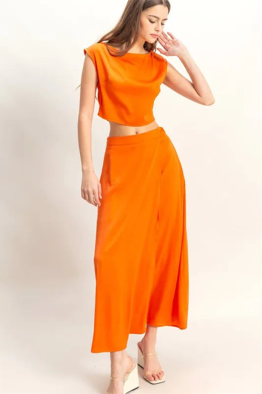 Sleeveless top and maxi skirt set in Orange on model.