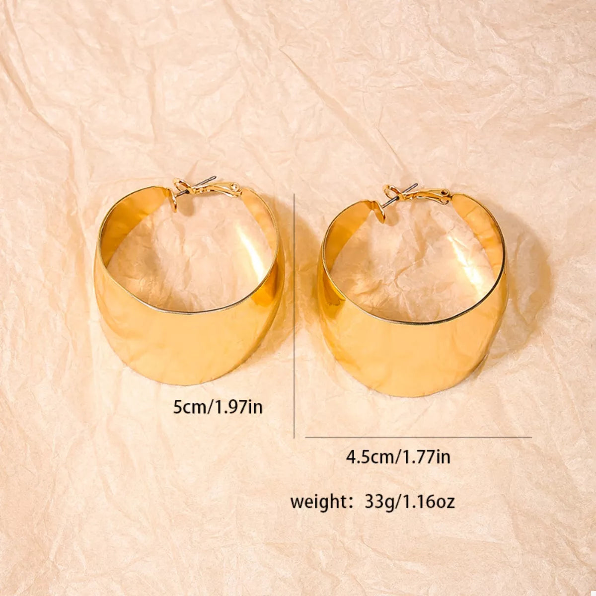 Wide Gold Hoop Earrings for Women displayed on a model.