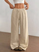 Women's plus size cotton drawstring wide leg pants, showing relaxed fit and tie waist.