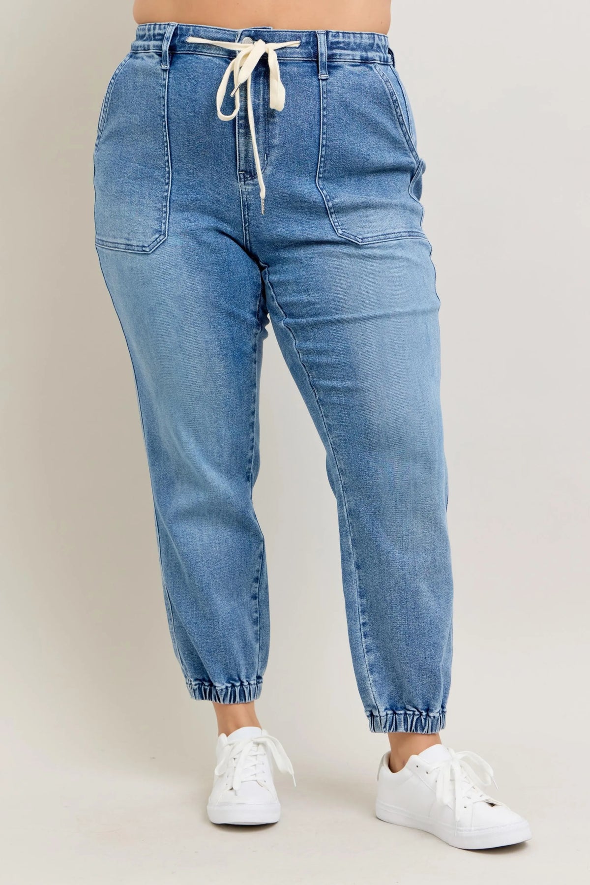 Judy Blue High Waist Denim Jogger in blue wash on model
