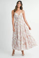 Floral Print Tiered Cami Maxi Dress in White worn by a model, showcasing the tiered skirt and cami strap design.