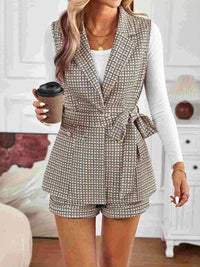 Model wearing belted houndstooth blazer vest and shorts set
