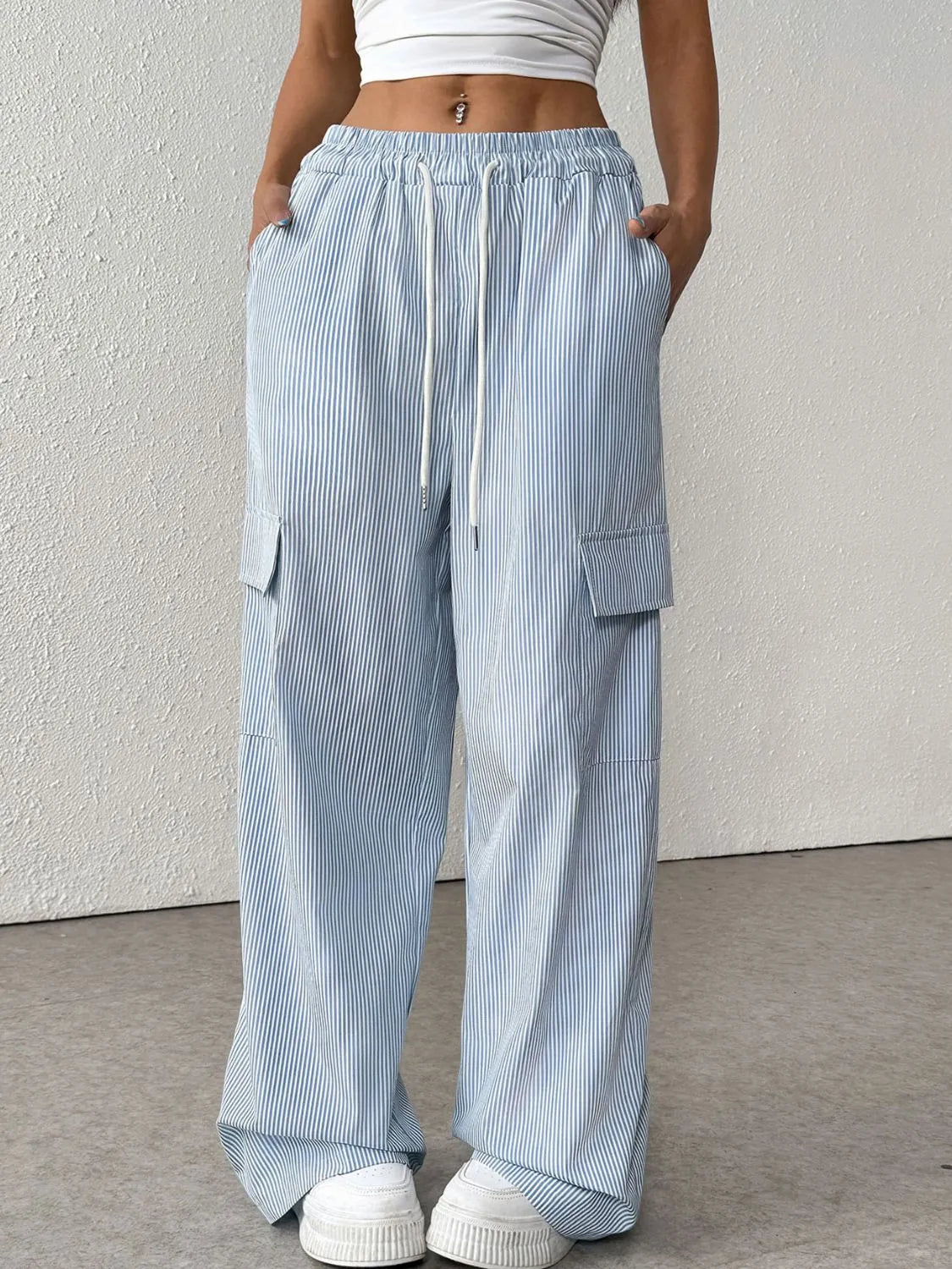Drawstring Striped Wide Leg Cargo Pants in Light Blue shown on a model, featuring side stripes and large cargo pockets.