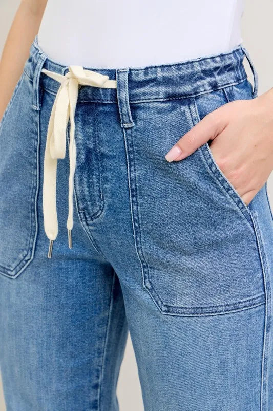 Judy Blue High Waist Denim Jogger in blue wash on model